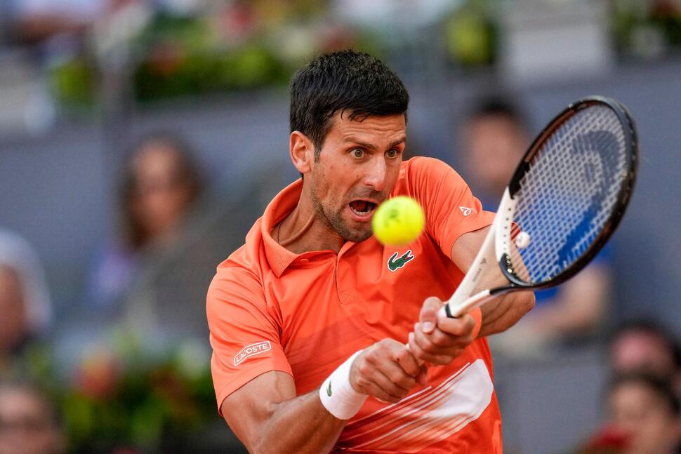 Djokovic’s march to victory halted by Wimbledon curfew